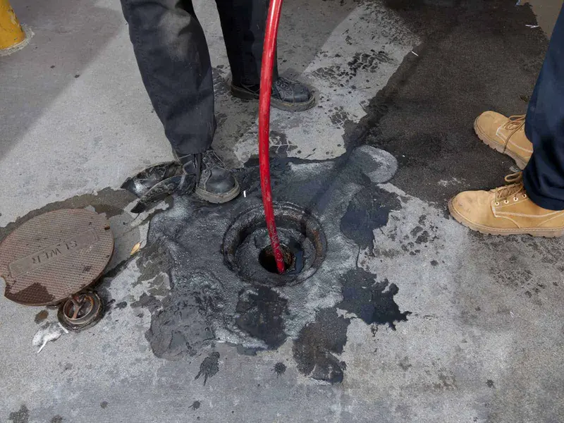 Silt being removed from a drainage chamber in Derby DE22